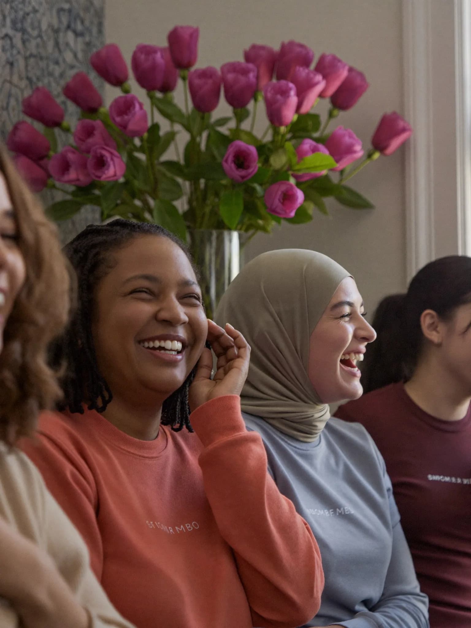 Women laughing together during a group session