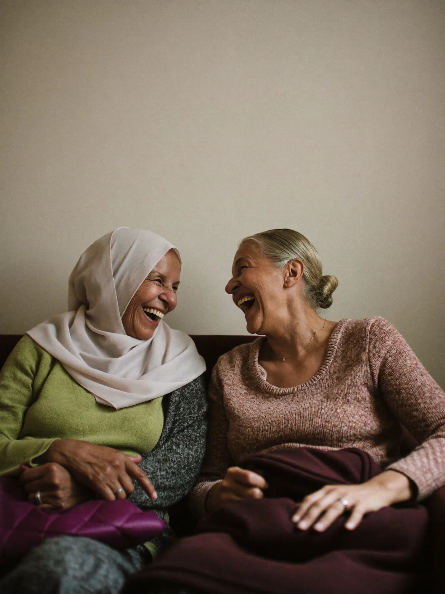 Two volunteers talking together at a community centre