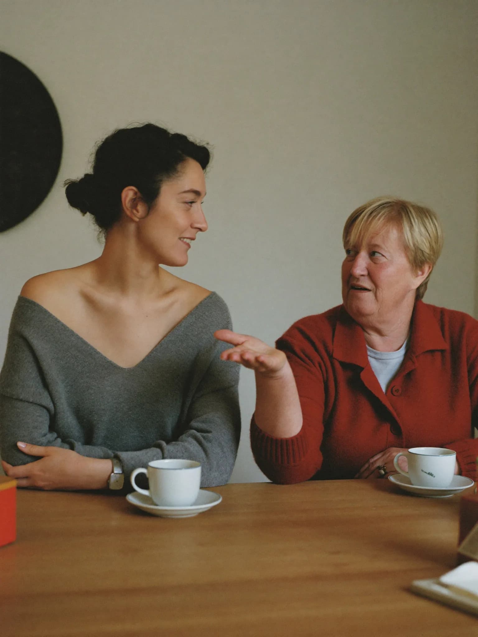 An adviser talking a woman through her options at a desk