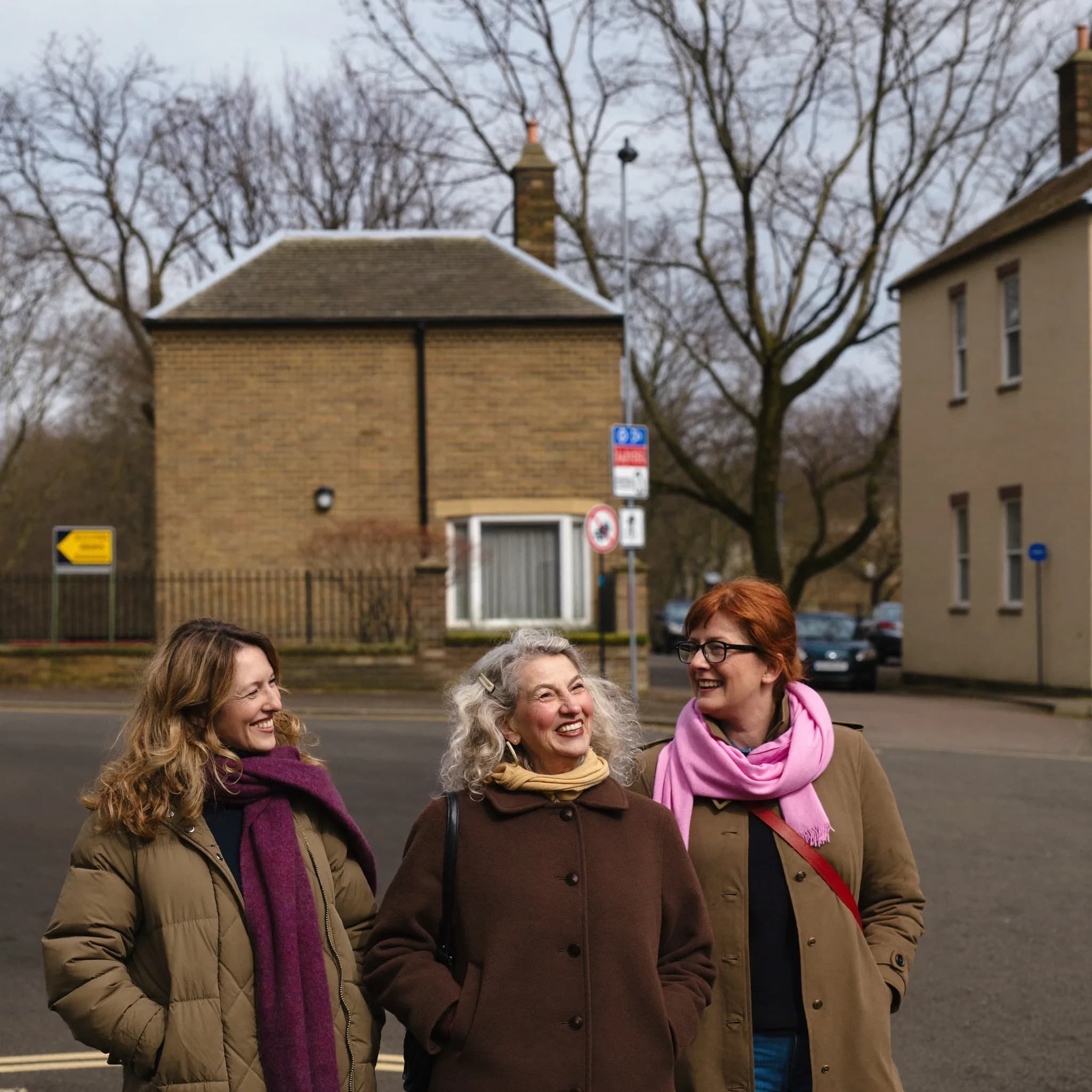 A diverse group of women standing together outside a community centre