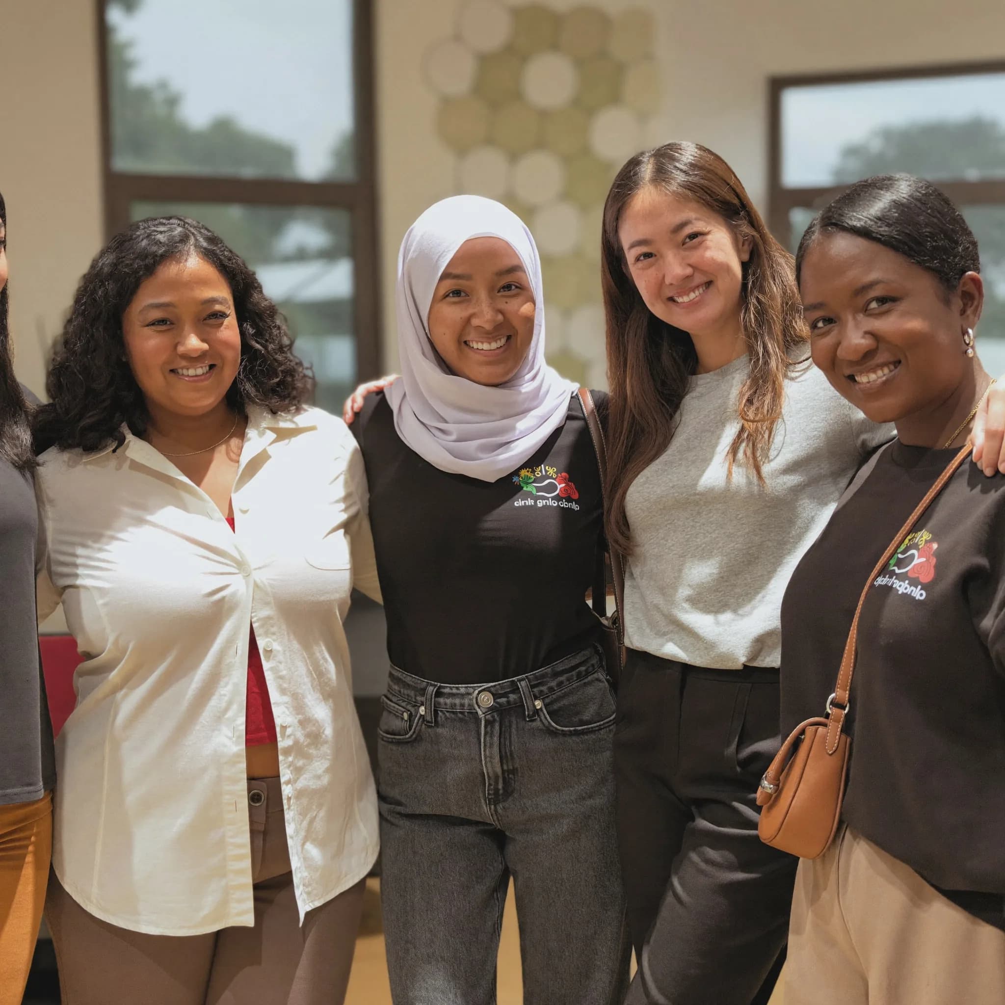 A group of women standing together outside a community centre