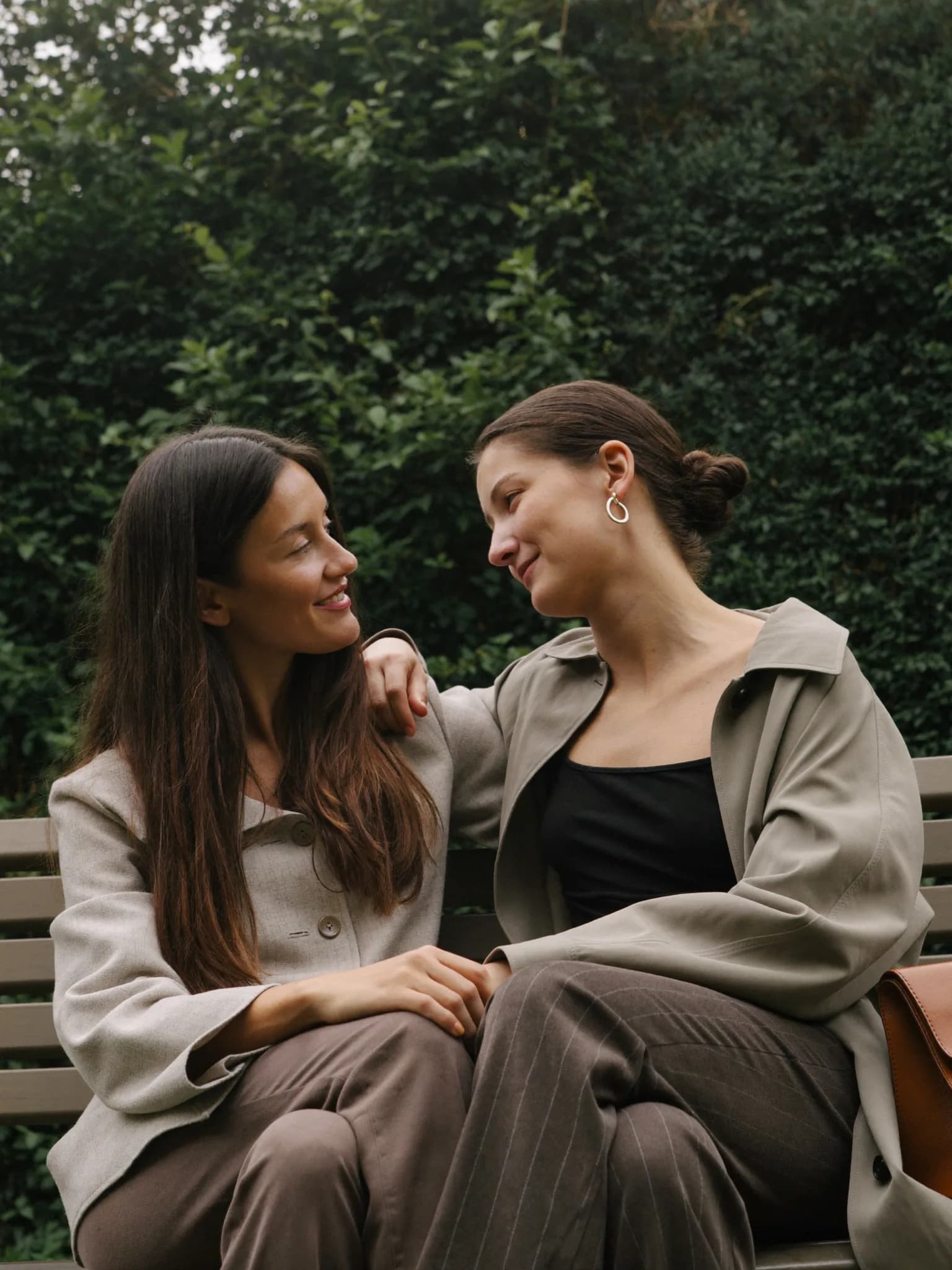 Two women talking supportively side by side